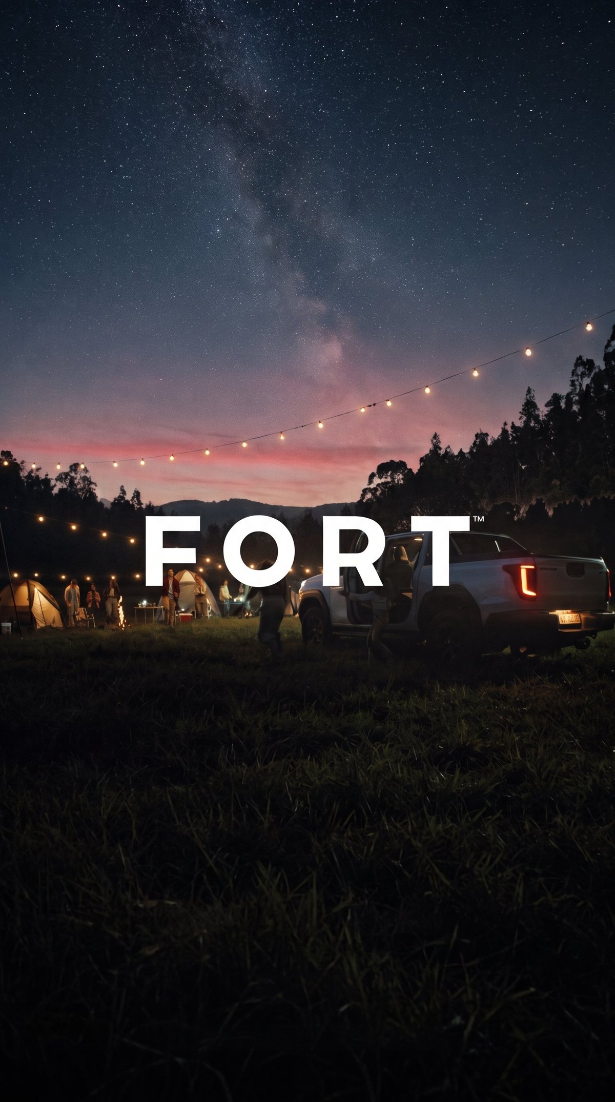 Outdoor nighttime gathering with parked truck, string lights, and Milky Way galaxy visible above forest landscape